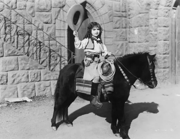 Cowgirl op pony — Stockfoto