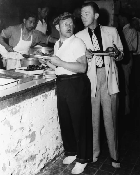 stock image Men in food line