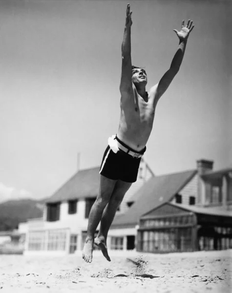 Jumping man in midair — Stock Photo, Image