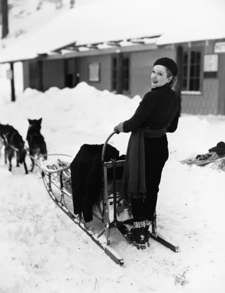 Woman on dogsled — Stock Photo, Image