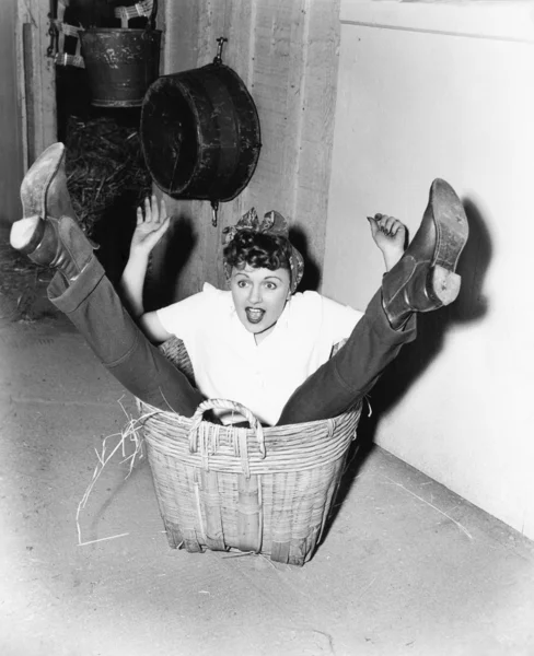 Woman falling into basket — Stock Photo, Image