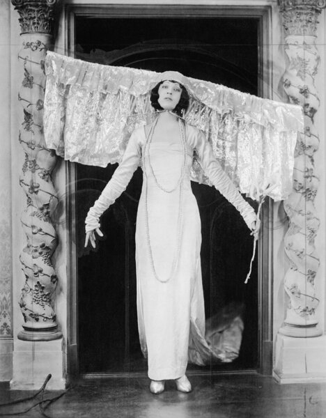 Woman wearing large headdress