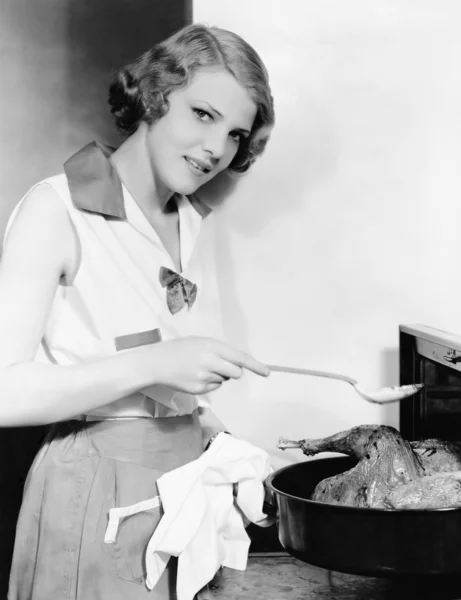 stock image Portrait of woman basting bird