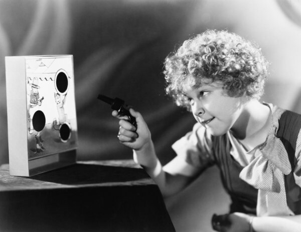 Girl playing with a gun