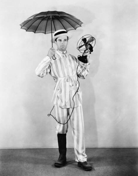 The weather man with umbrella, boot and fan