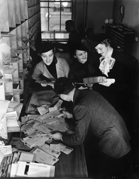 Group of going through a pile of mail — Stock Photo, Image