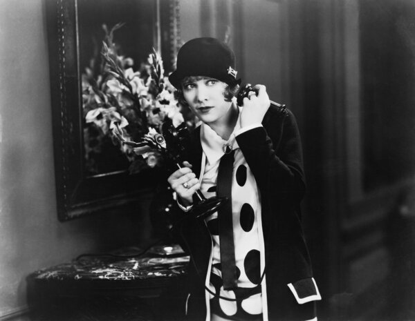 Woman in a hallway listening on the telephone