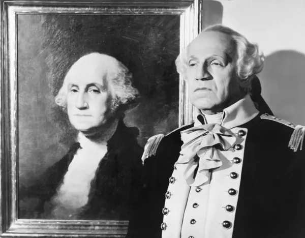 Portrait of George Washington with an impersonator next to the image — Stock Photo, Image