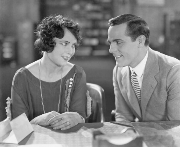 Couple sitting together and flirting