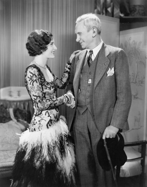 Woman greeting an older man