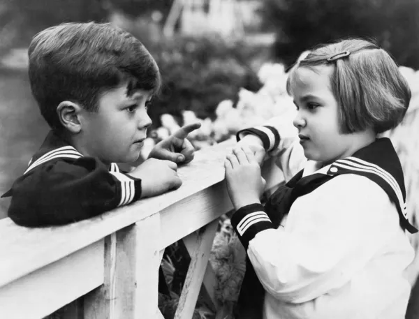 Brother and sister talking with each other — Stock Photo, Image