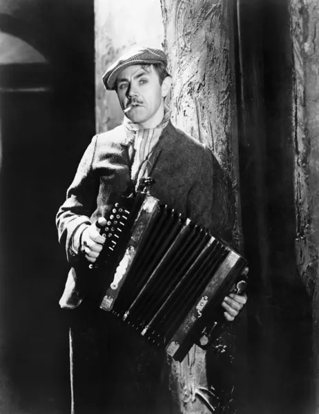 Man playing an accordion — Stock Photo, Image