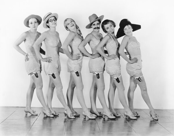 Women standing in a chorus line in lingerie