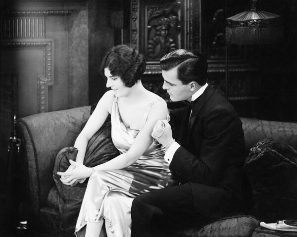 Couple sitting together on a couch