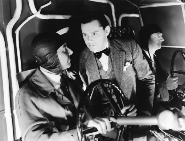 Three men inside of the cockpit of an airplane — Stock Photo, Image