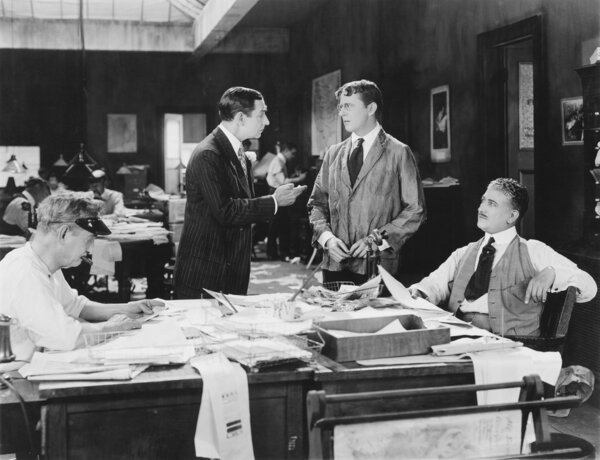 Four men at an office