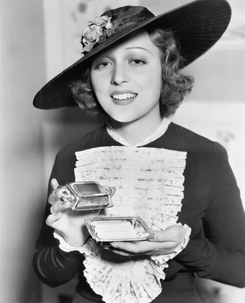 Woman with cigarette case Stock Image