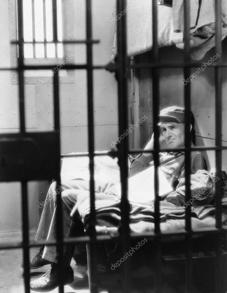 depositphotos_12290716-stock-photo-portrait-of-man-in-jail.jpg