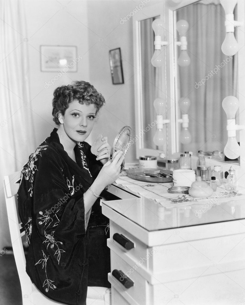 Portrait of woman at dressing table