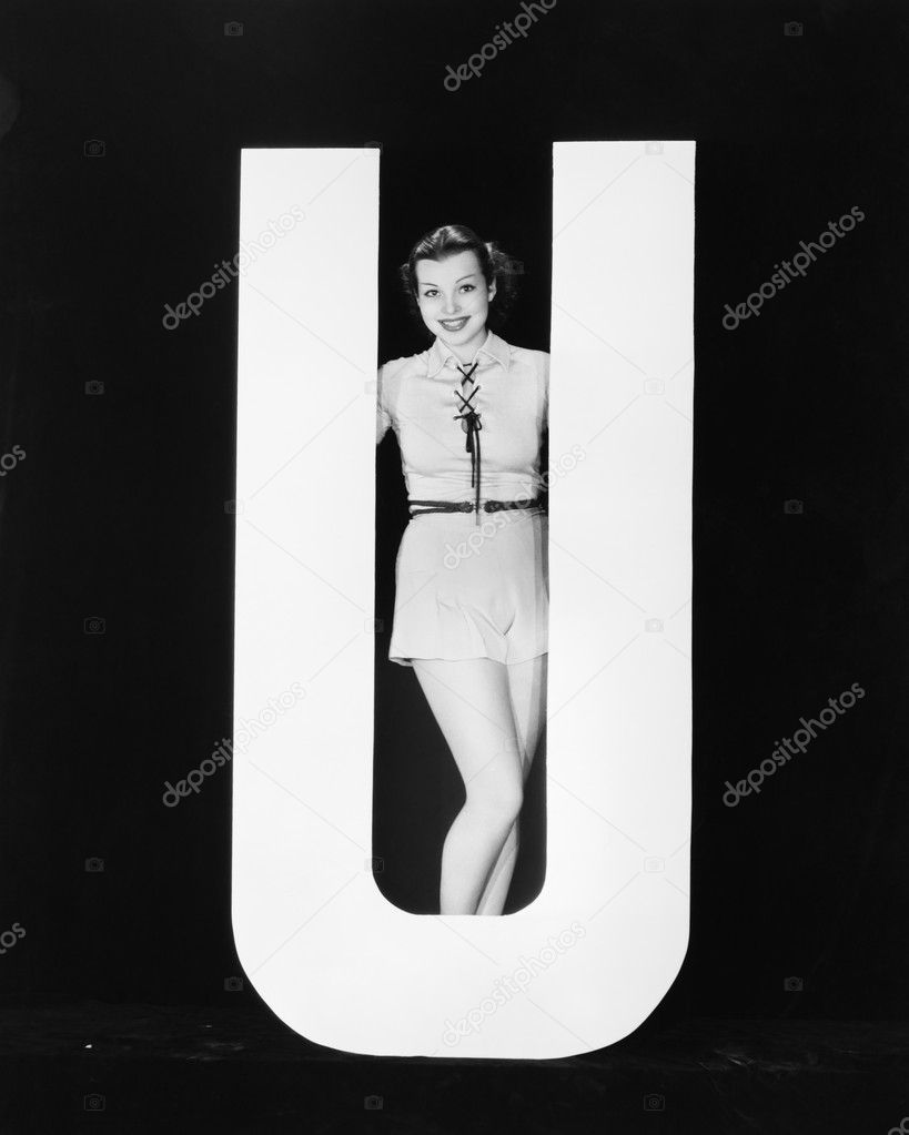 Woman posing with huge letter U