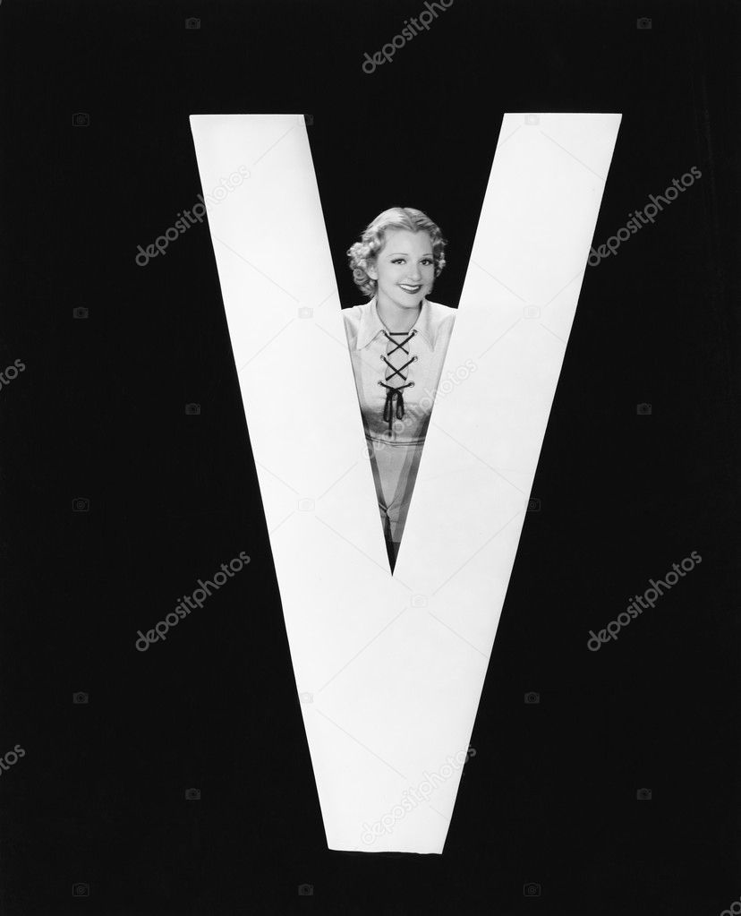 Woman posing with huge letter V