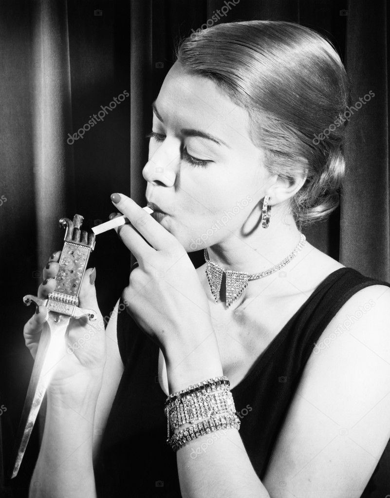 Closeup of woman lighting cigarette