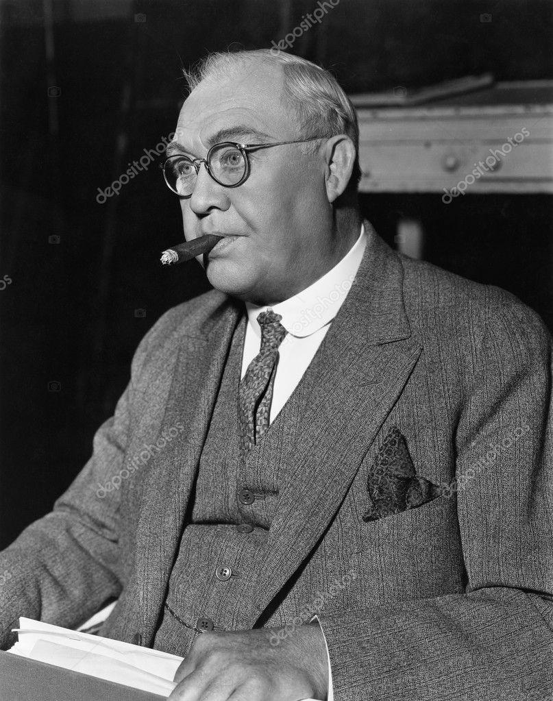 Portrait of businessman smoking cigar — Stock Photo © everett225 #12293203