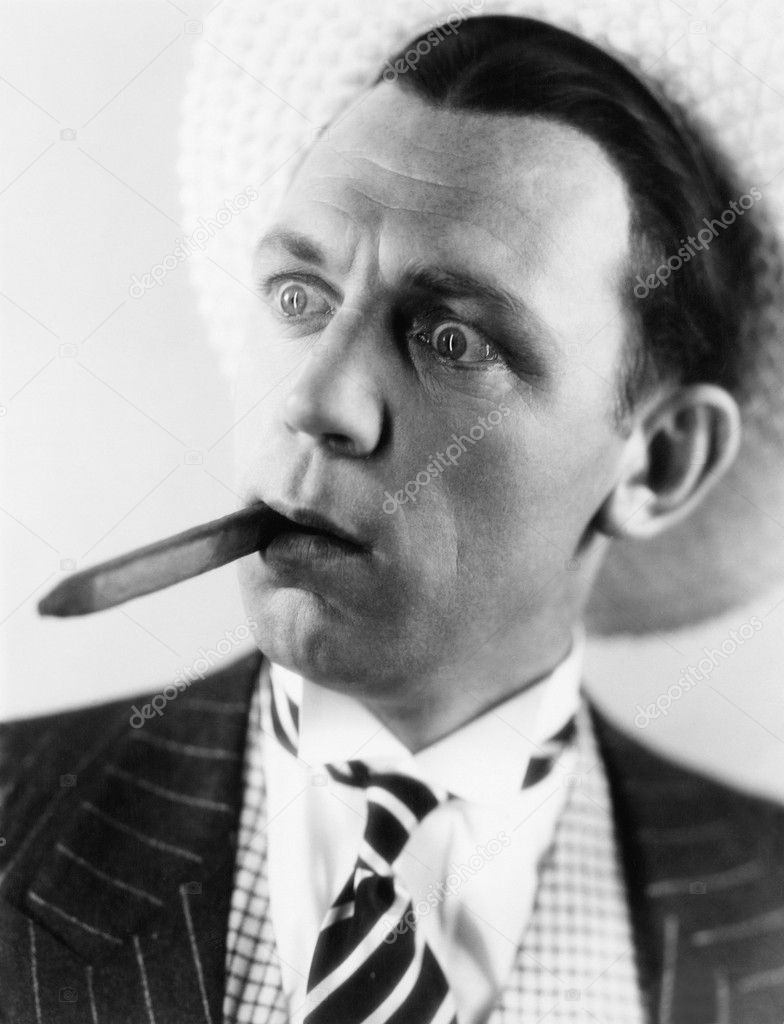 Man with a cigar in his mouth looking surprised