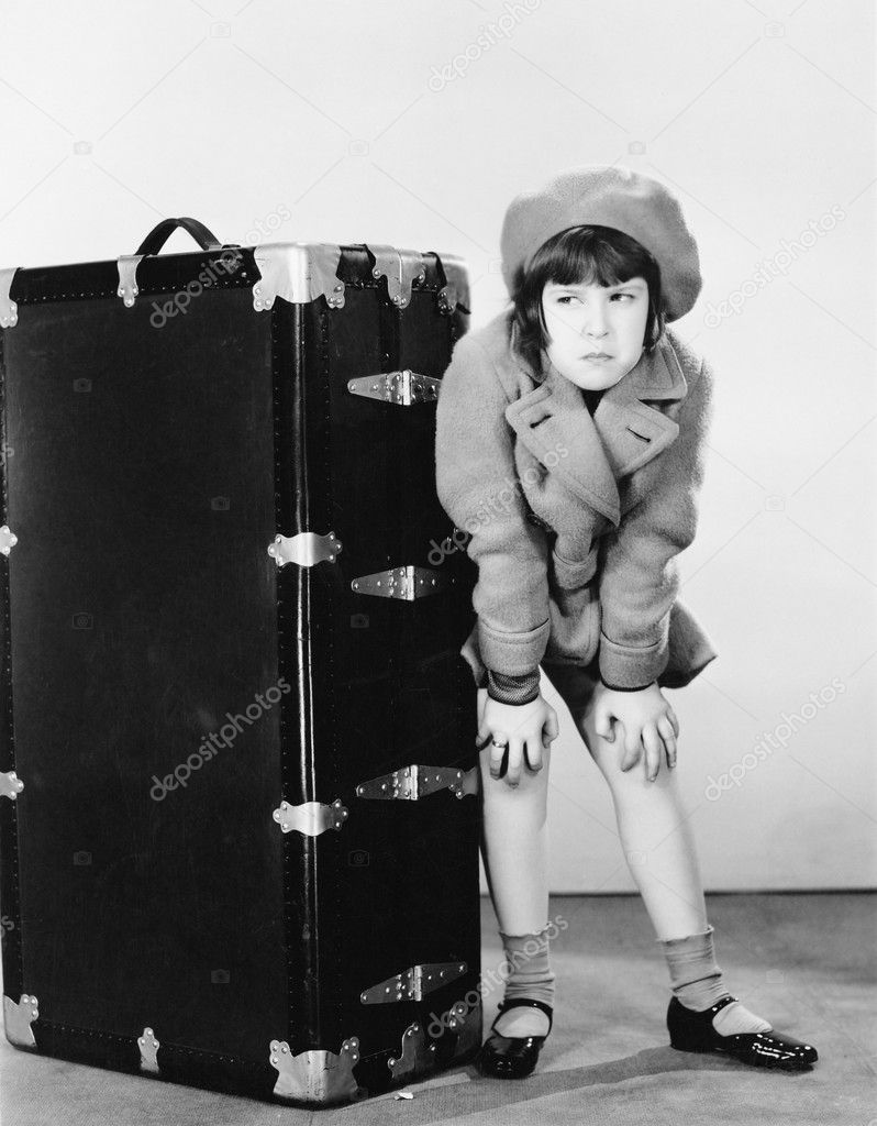 Girl standing next to suitcase Stock Photo by ©everett225 12293917