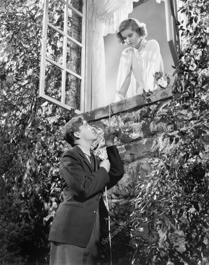 Man pulling himself up a string to get to the window of his girlfriend —  Stock Photo © everett225 #12298236