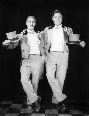 Two performers posing after a dance clipart