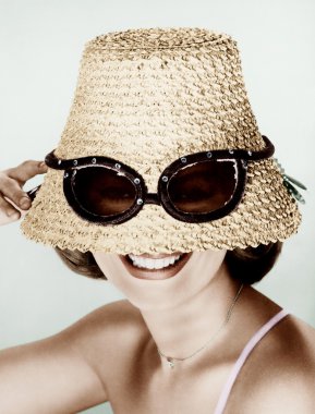 Woman wearing hat with fake sunglasses clipart