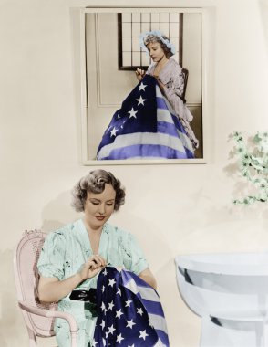 Woman sitting under the portrait of Betsy Ross sewing the American flag clipart