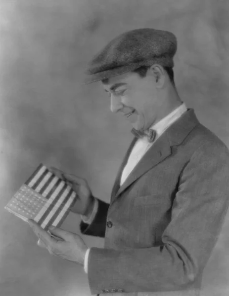 Smiling man looking at flag — Stock Photo, Image