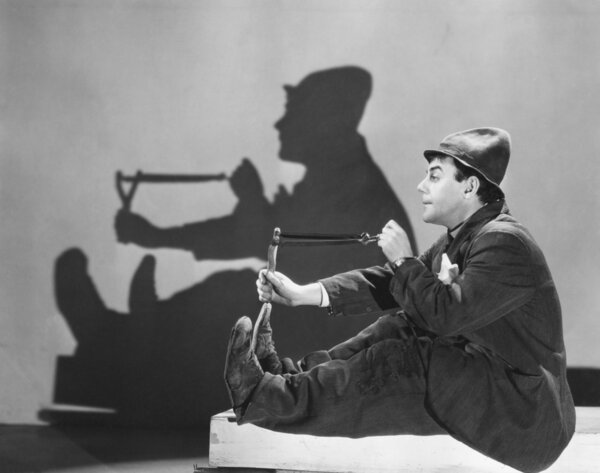 Man aiming slingshot