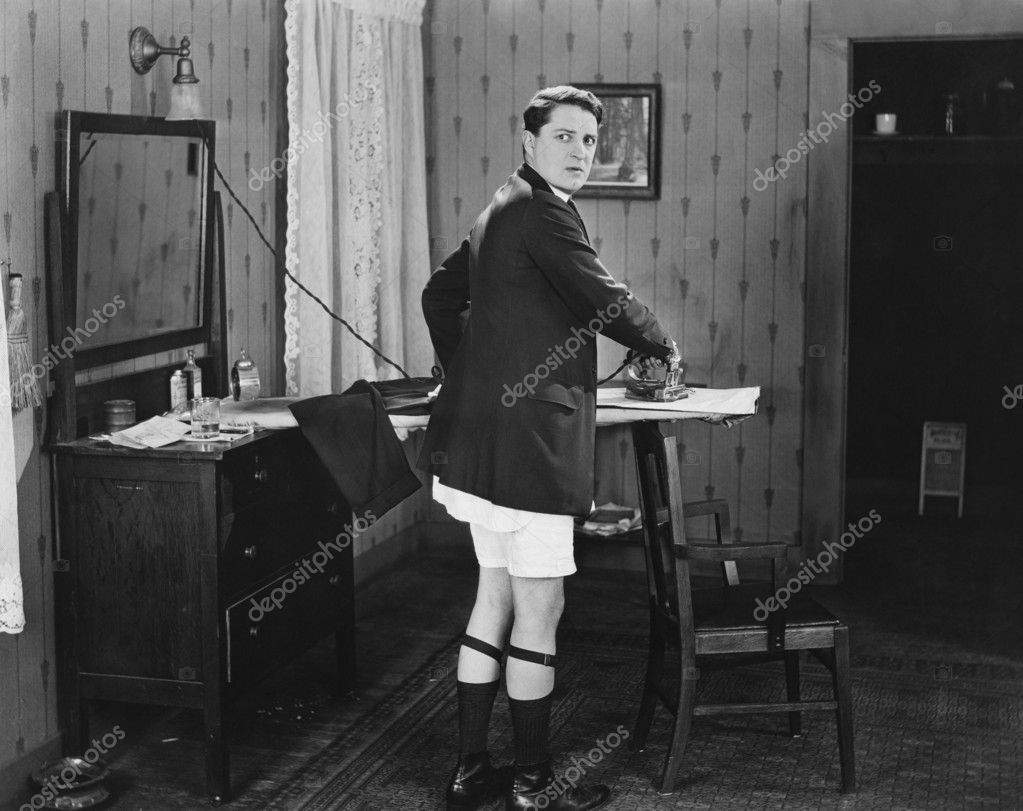 Man in sock garters ironing — Stock Photo © everett225 #12301675