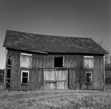 Old barn in field clipart