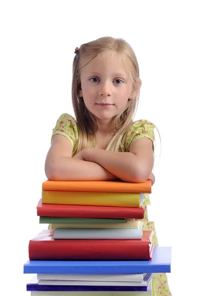 Dziewczynka z stos książek — Zdjęcie stockowe