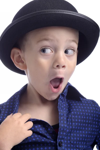 Cute little boy with bowler hat making faces — Stock Photo, Image