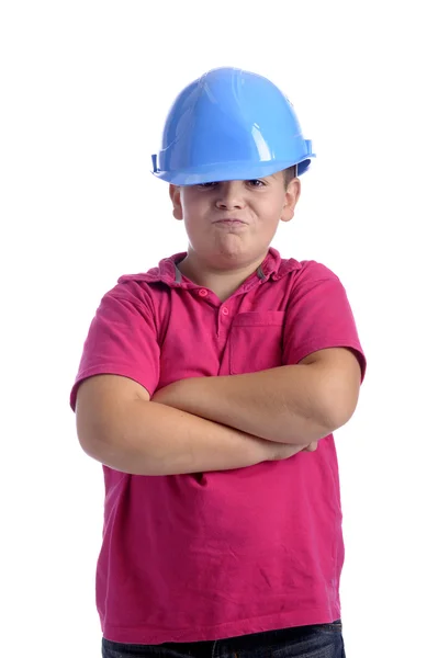 Boy with blue workers helmet, arms crossed — Stock Photo, Image