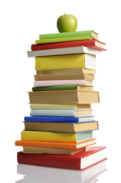 Stack of books with green apple — Stock Photo, Image