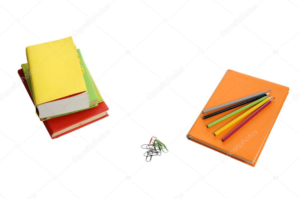 Books, pencils and paper clips on white