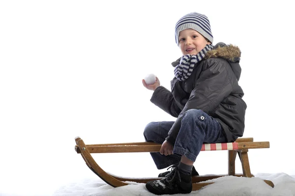 Little boy on sledge — Stock Photo, Image