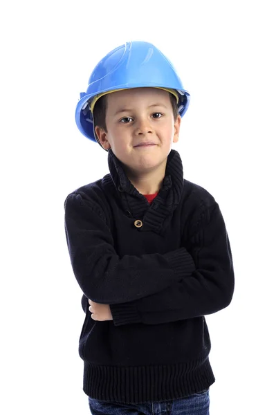 Niño, brazos cruzados, con casco de protección Imagen De Stock