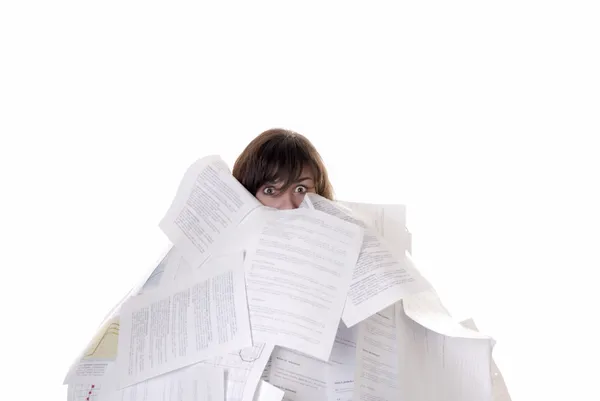 Businesswoman drowning in a mountain of papers — Stock Photo, Image