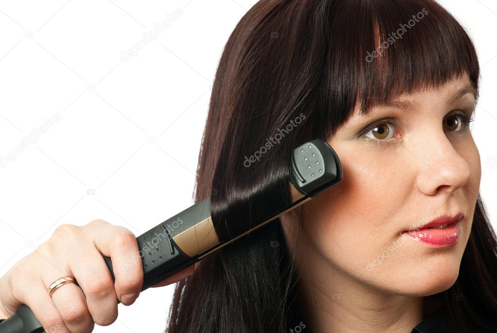 Woman straightening hairs