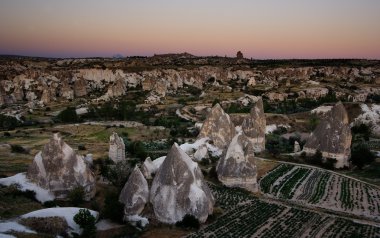 Goreme view over fields during sunset clipart