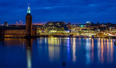 Stockholm cityhall skyline during night clipart