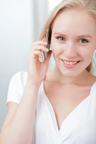 stock image Young woman speaking on a cell phone