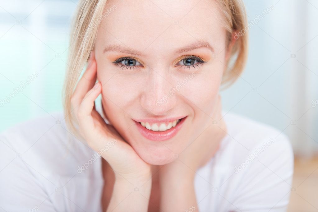 Closeup portrait of happy attractive young woman